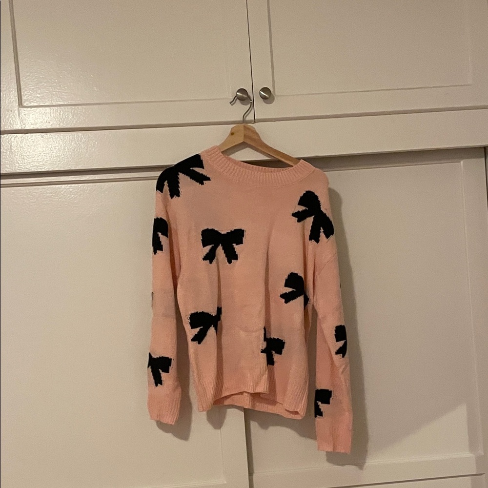 Pink Sweater with Black Bow Accents